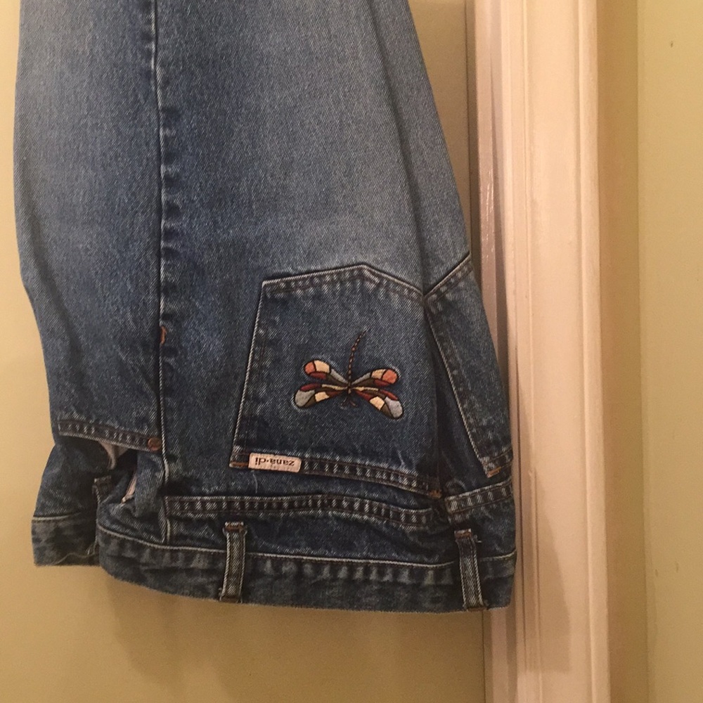 Flare legged blue jeans. No holes.